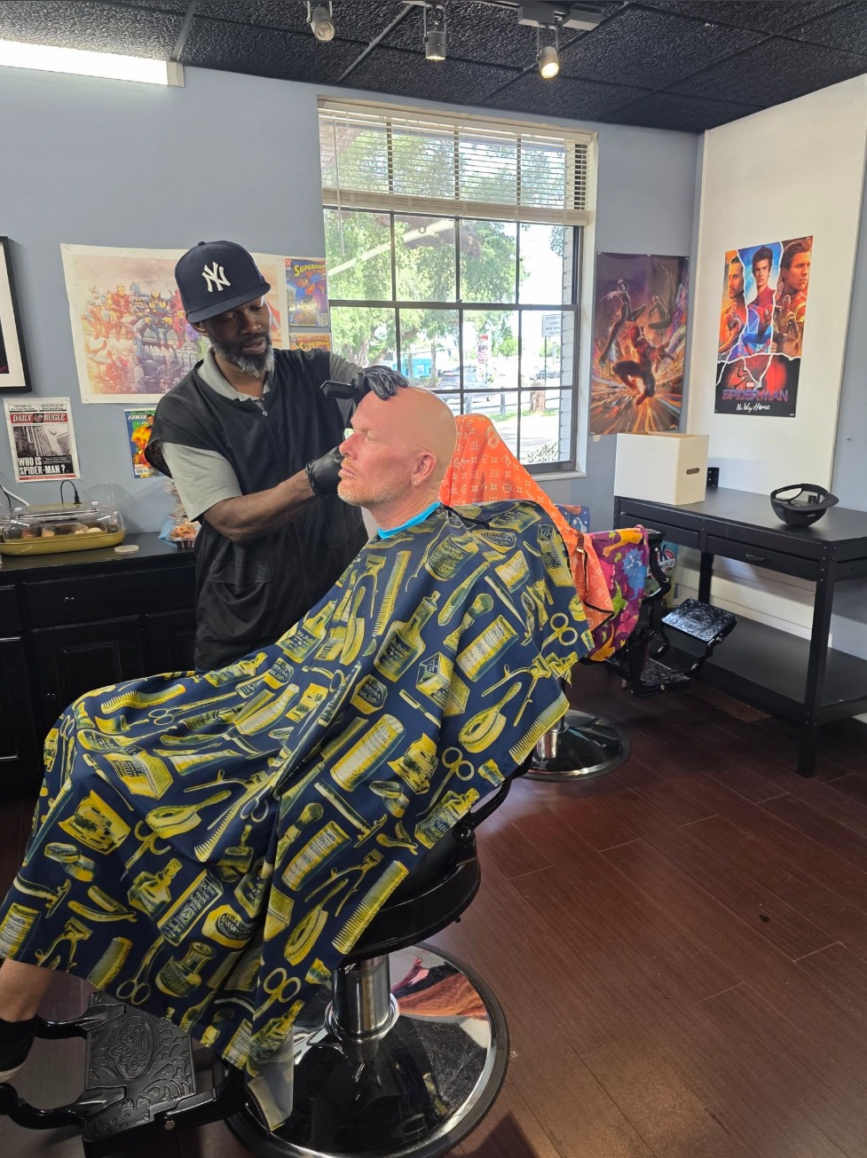 Marvin cutting hair at Heroes Only Brandon